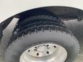 Close-up of a tire on a 2005 Freightliner MT45 Chassis showcasing the tread pattern and wheel rim