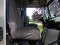 Interior view of a 2007 Morgan Olson Workhorse W42 with a gray fabric driver's seat and a dashboard displaying controls and instruments