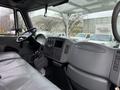 Interior of a 2007 International 4200 with a steering wheel dashboard and leather seating