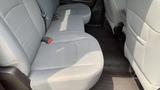 A 2013 RAM 2500 with a spacious back seat featuring grey fabric upholstery and seat belts