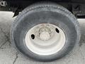 A close-up of a tire mounted on the wheel of a 2007 International 4300 truck showing tread pattern and wheel design