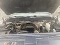 A view of the open hood of a 2015 Chevrolet Silverado 3500HD revealing the engine compartment and its components