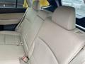 A beige leather backseat of a 2019 Subaru Outback with comfortable seating and headrests