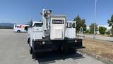 A white 2011 Ford F-450 SD equipped with a Hi-Ranger aerial lift system mounted on the back