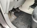 Interior floor of a 2013 Toyota Sienna showing a rubber floor mat pedals and footrest area