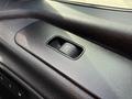 A 2019 Mercedes-Benz Sprinter featuring a close-up view of the door lock button on a textured black panel
