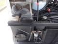Close-up of the engine compartment of a 2007 Morgan Olson Workhorse W42 showing a black air intake hose and surrounding engine components