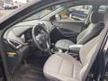 Interior of a 2017 Hyundai Santa Fe showing front seats dashboard and steering wheel