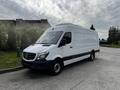 A white 2016 Mercedes-Benz Sprinter van parked at an angle showcasing its sleek body and large cargo area with black accents