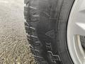 Close-up of a 2017 Ford F-150 tire showcasing its tread pattern and sidewall design