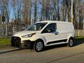 A white 2022 Ford Transit Connect van with a black grille and wheels is parked on a paved surface