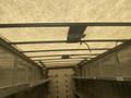 Interior view of a 2007 Freightliner MT55 van showing metal framework and overhead lighting in a spacious cargo area