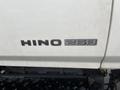 A close-up view of the Hino 268 logo displayed in black on a white surface
