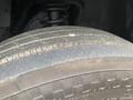 Close-up of a worn tire from a 2014 RAM 5500 showing tread wear and dirt on the surface