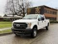 A white 2017 Ford F-350 Super Duty pickup truck is parked with a cab and truck bed visible