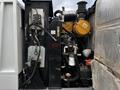 2007 Tennant Sentinel with visible engine components including hydraulic lines filter and control panel