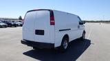 A white 2012 GMC Savana van viewed from the rear with a clean design and silver wheels