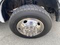 Close-up of a chrome wheel with a Michelin tire mounted on a 2010 Ford F-550