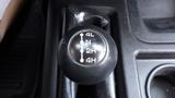 A close-up of the gear shift knob from a 2014 RAM 5500 displaying options for 4L 2H N 4H and 2H