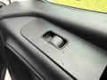 A close-up view of the power window control button on the door panel of a 2019 Mercedes-Benz Sprinter