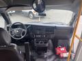 Interior view of a 2017 Chevrolet Express showing the driver's seat steering wheel dashboard and control panel