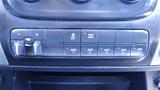 Control panel of a 2014 RAM 5500 featuring buttons for off, tow/haul, auxiliary functions, and power take-off