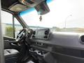 Interior view of a 2019 Mercedes-Benz Sprinter showcasing the dashboard with a touchscreen display and steering wheel