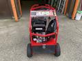 A red 2024 Magnum 4000 Hot Water Pressure Washer with a black engine compartment and various control buttons on the top panel