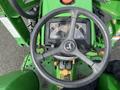 John Deere 790 tractor steering wheel and dashboard displaying gauges and controls