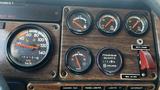 Dashboard of a 1995 Freightliner FLL086 displaying various gauges including speedometer, oil pressure, and hour meter