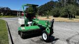 A green 2017 Laymor SweepMaster 300 with a large sweeping brush and a white water tank attached is parked on a paved area