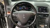 Interior view of a 2013 Lincoln MKT showing the dashboard steering wheel and control panel with various displays and buttons