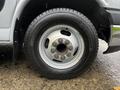 2015 Chevrolet Express wheel with a Michelin tire showing a silver rim and visible lug nuts