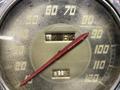 Close-up of a vintage speedometer from a 1947 Harley-Davidson WL showing speeds marked from 0 to 120 with a red needle indicating 17.62 miles per hour