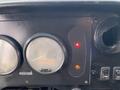 Dashboard of a 2005 Freightliner MT45 Chassis featuring speedometer and warning lights