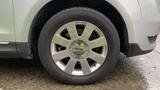 Close-up of a silver rim on a 2013 Lincoln MKT tire featuring a distinctive spoke design and the Lincoln emblem in the center