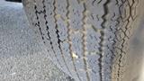 Close-up of a worn tire showing distinctive tread patterns and signs of cracking on a 1971 Chevrolet Corvette Stingray