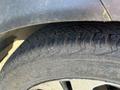 Close-up of the tire of a 2012 Kia Sportage showing the tread pattern and sidewall detail