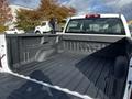 A 2017 GMC Sierra 1500 truck bed featuring a spray-on liner and visible GMC branding on the back wall