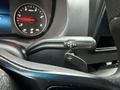 Close-up of the gear shift lever of a 2019 Mercedes-Benz Sprinter displaying positions for reverse neutral and drive
