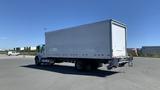 A 2019 International 4300 box truck with a white cargo area and YRC logo on the side facing away from the viewer