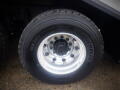 Close-up of a wheel and tire from a 2008 International 7400 featuring a silver aluminum rim and a Michelin tire with prominent tread pattern