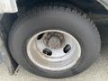 A close-up view of a tire and wheel from a 2017 Chevrolet Express showcasing the tread and wheel design