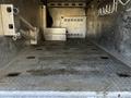 Interior of a 2018 Ford F-550 cargo area featuring a metal floor with diamond tread and equipment storage compartments on the left side