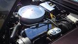 Engine compartment of a 1971 Chevrolet Corvette Stingray featuring a polished chrome air cleaner and various engine components