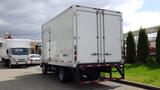 A 2016 Hino 195 box truck with a white exterior and rear double doors parked on a lot