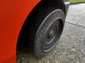 Close-up of a black rubber tire mounted on a 2017 Toyota 8FCGCU25 forklift showing tread details and a shiny rim