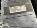 A close-up of a Duramax Diesel engine cover with a label detailing important engine and vehicle emission control information