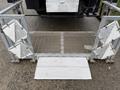 A metal loading ramp with folding sides and a flat surface designed for a 2017 Kenworth T370 vehicle