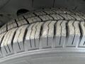 Close-up of a tire tread on a 2017 Chevrolet Express showing distinct patterns and grooves designed for traction